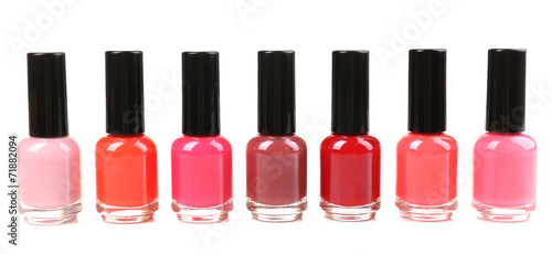 Colorful nail polishes isolated on white