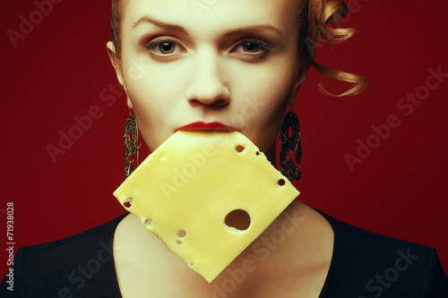 Addicted to cheese concept. Fashionable model with cheese