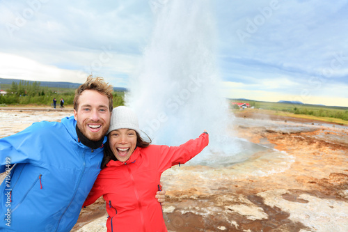 Iceland tourists fun by Strokkur geyser