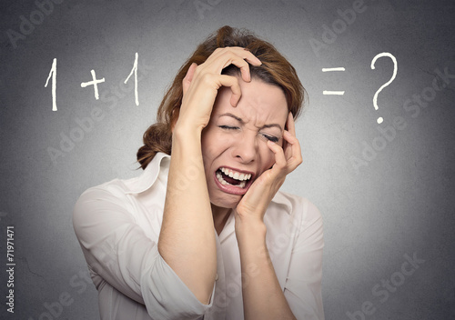 Headshot woman can't solve problem stressed on grey background 