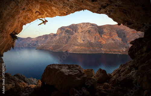 Male rock climber on a cliff in a cave at Kalymnos, Greece
