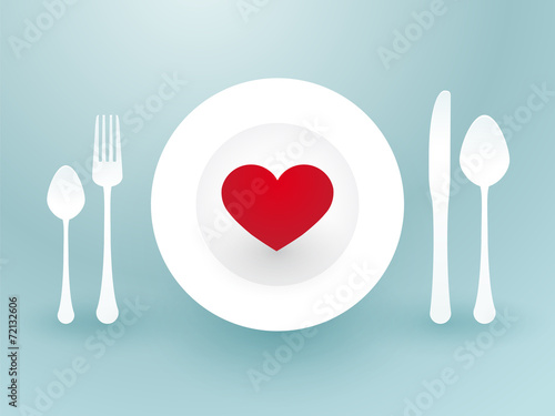 fork knife and a red heart on a plate