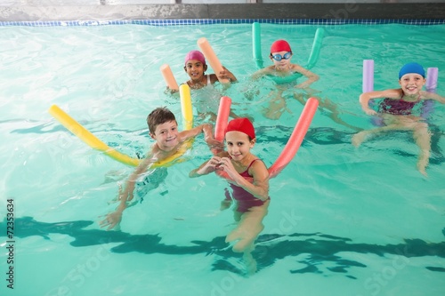 Cute little kids in the swimming pool