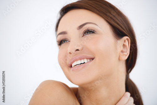 Young woman with a dreamy happy expression
