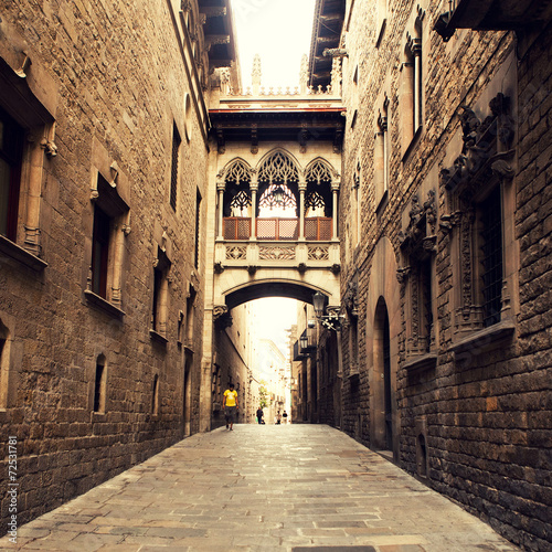 Gothic street with arch in Barcelona close to Cathedral.