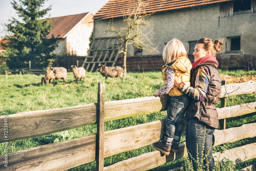 Portrait of mother and child on farm