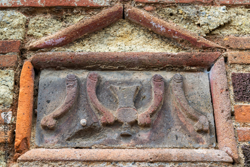 Relief image of phalluses on brothel wall in Pompeii, Italy. House exterior detail.