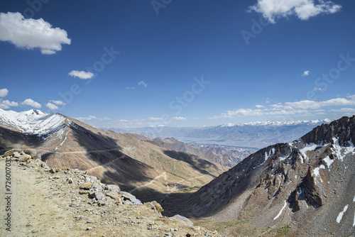 Aerial view to serpentine road, mountain range and valley of Leh