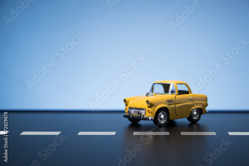 Yellow fifties toy model car.