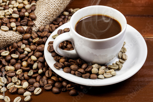 Coffee cup and jute sack full of coffee beans 6