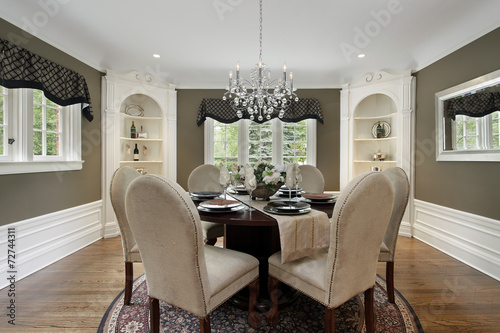 Dining room with white cabinetry