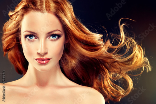 Beautiful model with long curly red hair