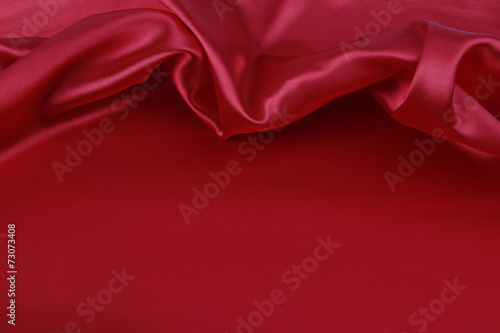 Red silk fabric. Copy space