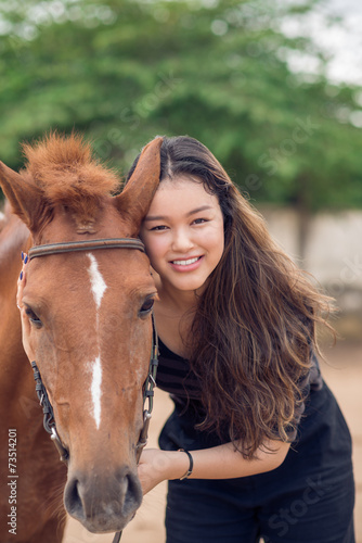 Girl with chestnut pony