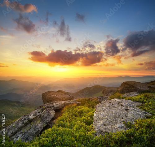Bright sunset in mountain in summer time