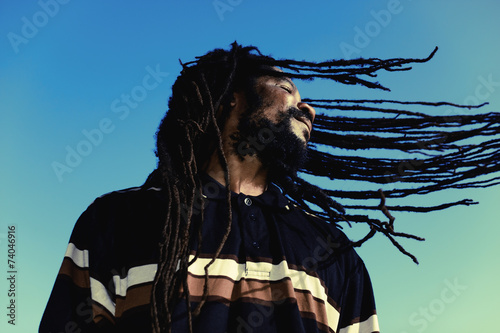 Happy man with “windy” dreadlocks. Caribbeans.