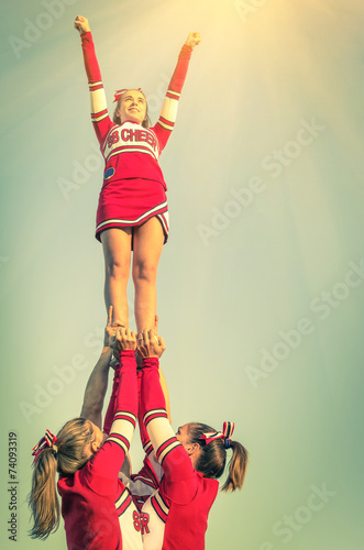 Cheerleaders in action on a vintage filtered look