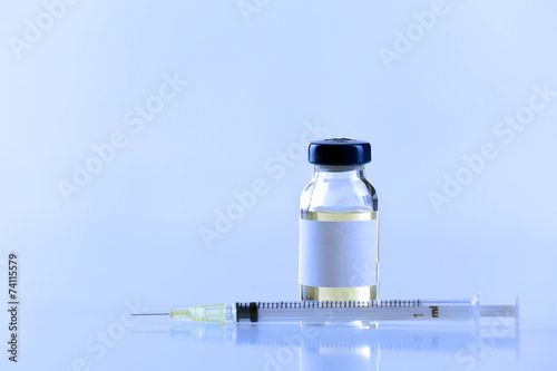 Vaccine in vial with syringe