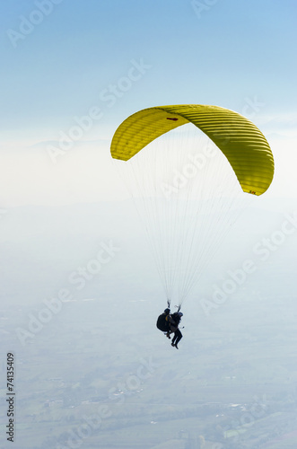 Paragliding high in the clouds 