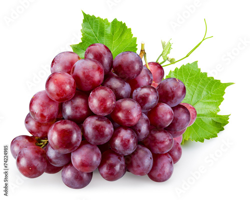 Ripe red grape with leaves isolated on white