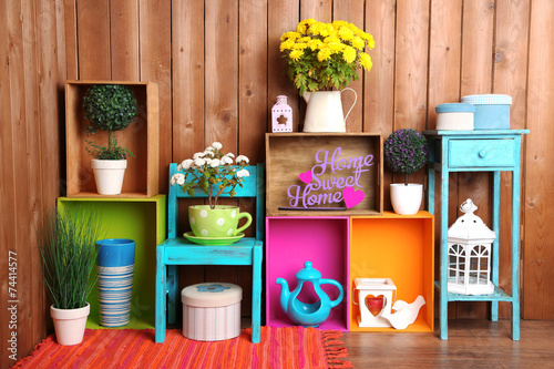 Beautiful colorful shelves with different home related objects