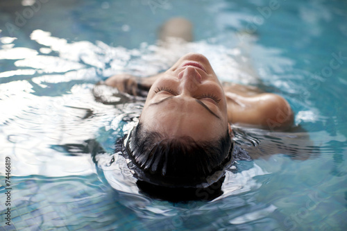 Young woman relaxing in the water 