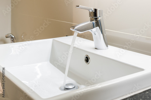 washbasin and faucet with water drop