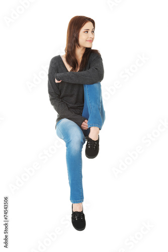 Sitting young happy woman
