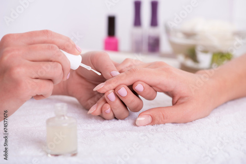 client and manicurist in manicure salon