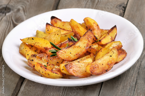 Potato wedges on white plate