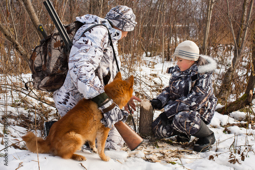 hunter shows his son traces of beavers