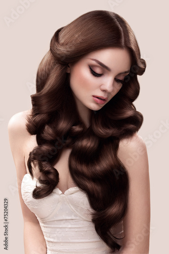 Hair. Portrait of Beautiful Woman with Long Wavy Hair. High qual