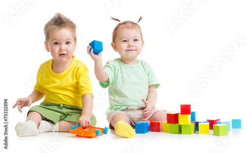 Adorable children playing colorful toys isolated