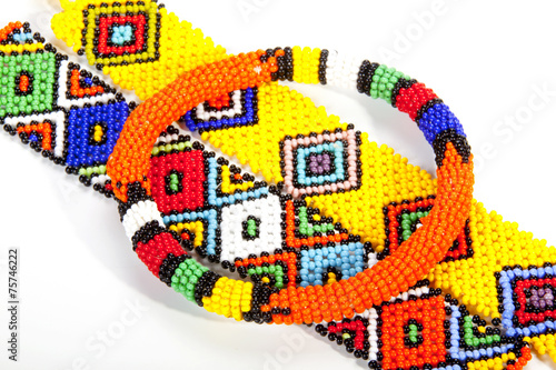 Circular Beaded Zulu Armband Atop Two Wristbands