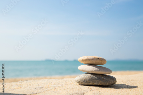 Stones balance, pebbles stack on sea sand beach