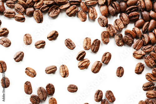 Coffee beans on white table, close-up