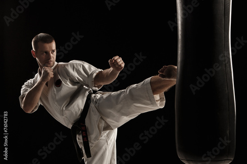 Karate round kick in a punching bag