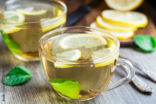 Cup with mint and lemon tea