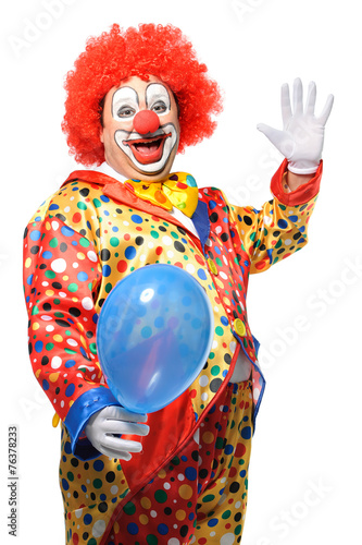 Portrait of a smiling clown with balloon isolated on white