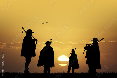 pipers silhouette at sunset