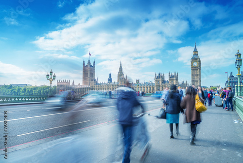 Blurred people moving on Westminster Bridge, London