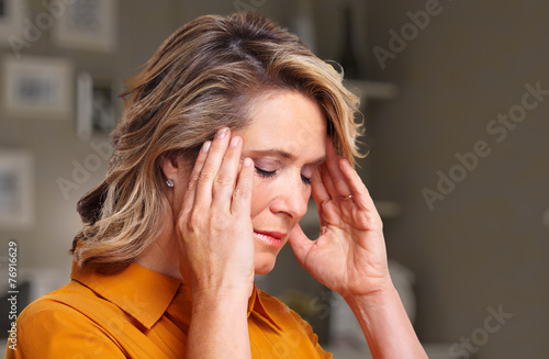 Woman having headache migraine.