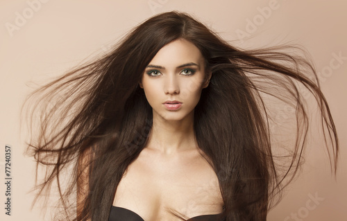 Beautiful woman with long healthy brown hair