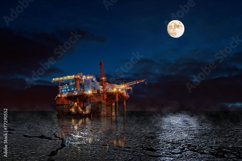 Oil Rig at night in winter scenery.