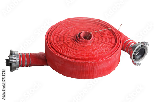 rolled up red fire hose extension soft pipe on white