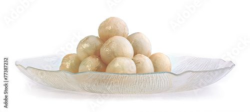 lychee fruit on the plate isolated in white.