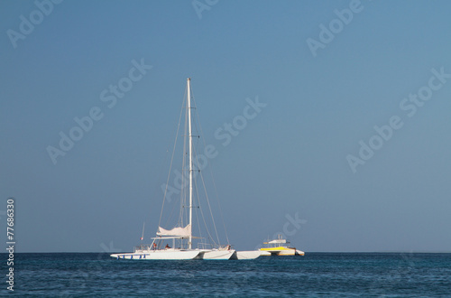 White trimaran in blue sea