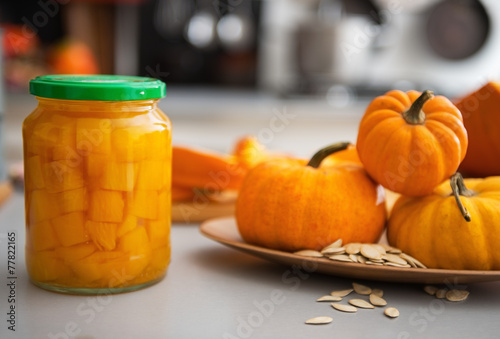 Closeup on jar of pickled pumpkin on table