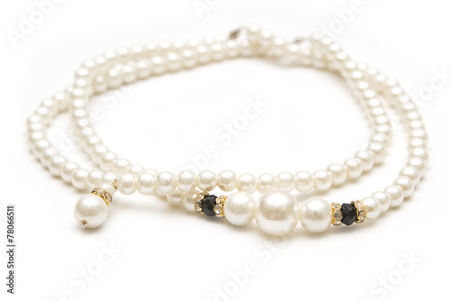 Beautiful pearl necklace on white