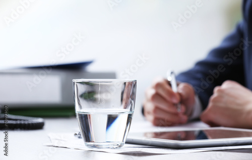 Businessman working at table in office